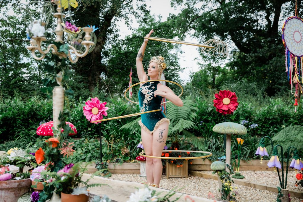 Pixie hula hoop artist for hire UK and internationally. Hula shows and walkabout act.